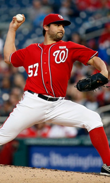 With Harper out, Marlins get doubleheader split with Nats